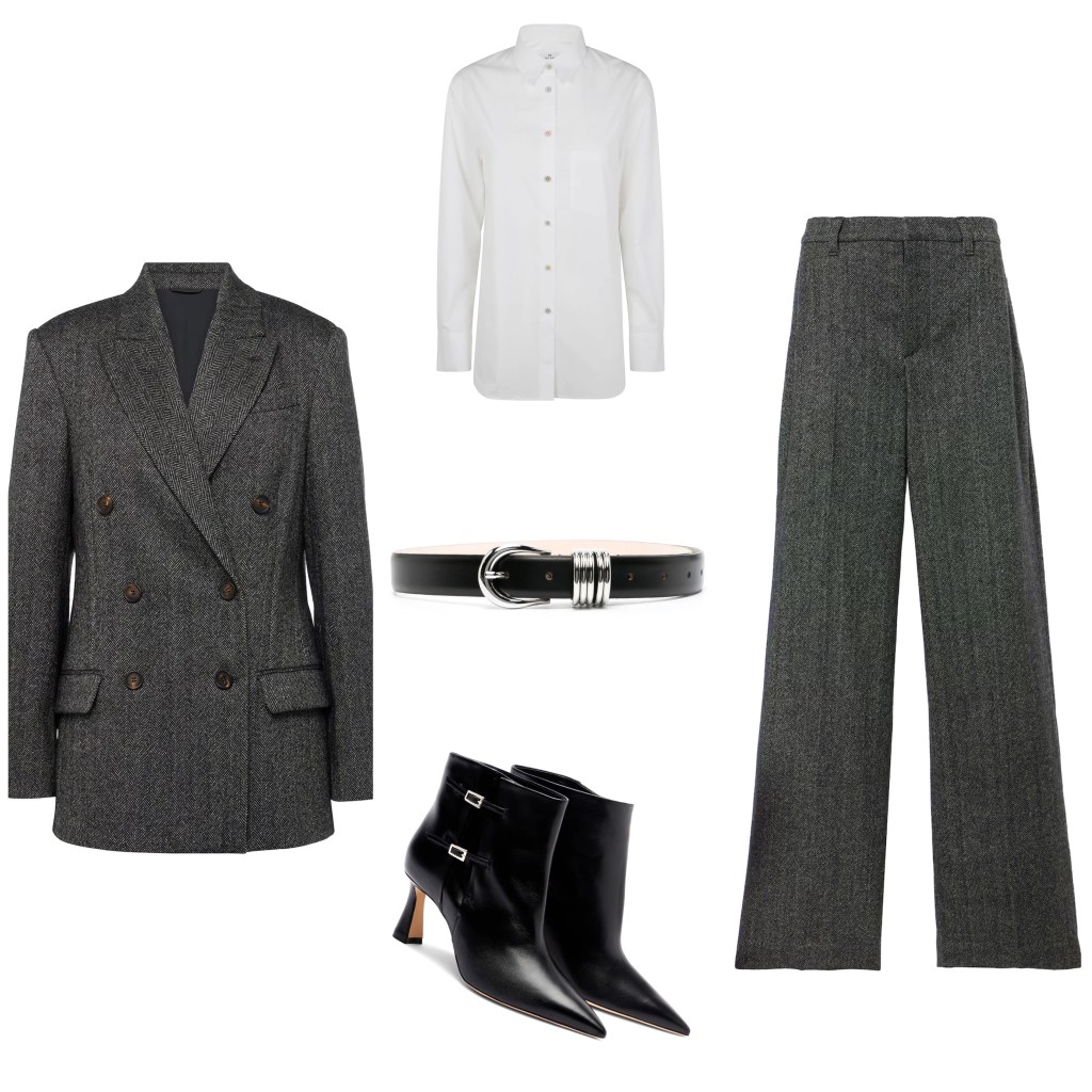 A modern fall fashion outfit featuring a grey double-breasted blazer, a white button-up shirt, high-waisted grey trousers, a black belt, and stylish black ankle boots.
